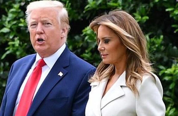 Мелания Трамп в белом пальто с золотыми пуговицами и белоснежных лодочках сопровождает мужа