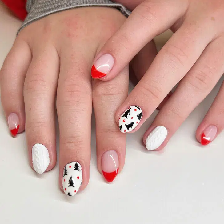 Белый маникюр с красным френчем и елочками на острых ногтях средней длины