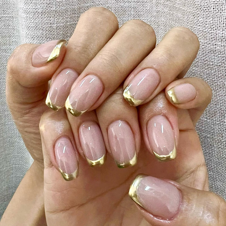 Winter gold jacket on long square nails